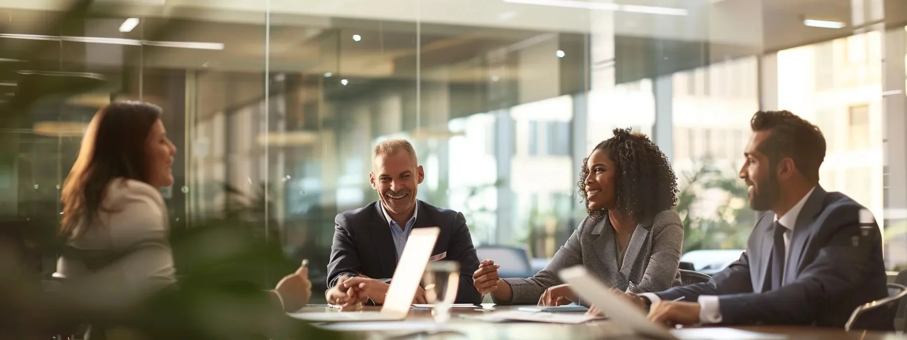 Four business professionals discussing the benefits of using account planning